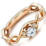 حلقه ازدواج زنانه با نگین الماس تراش برلیان تخمه و طلای رزگلد مدل vzg1001