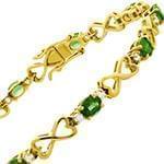 دستبند زنانه طلا با نگین الماس تراش برلیان و زبرجد طرح بینهایت مدل: bdf1258